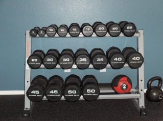 Dumbell rack with dumbells starting at the top left first leve is 5-25 lbs, second level is 30-40 lbs, lower 45-50lbs.